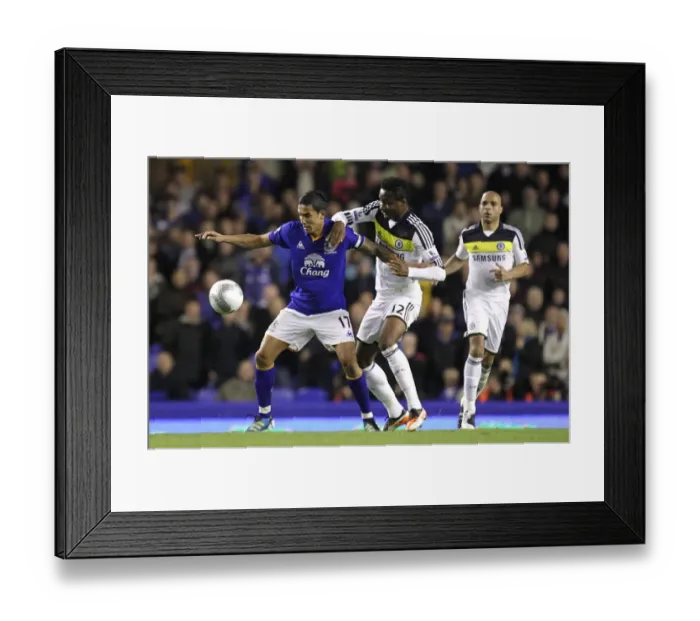 Framed Print : Tim Cahill vs Mikel: A Carling Cup Showdown at Goodison Park (2011) Framed Print : Tim Cahill vs Mikel: A Carling Cup Showdown at Goodison Park (2011)