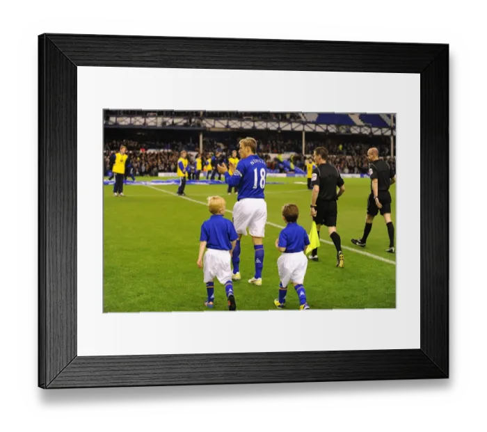 Framed Print : Phil Neville Greets Fans and Leads Mascots: Everton vs. Chelsea, Carling Cup Round 4 at Goodison Park (October 26, 2011) Framed Print : Phil Neville Greets Fans and Leads Mascots: Everton vs. Chelsea, Carling Cup Round 4 at Goodison Park (October 26, 2011)