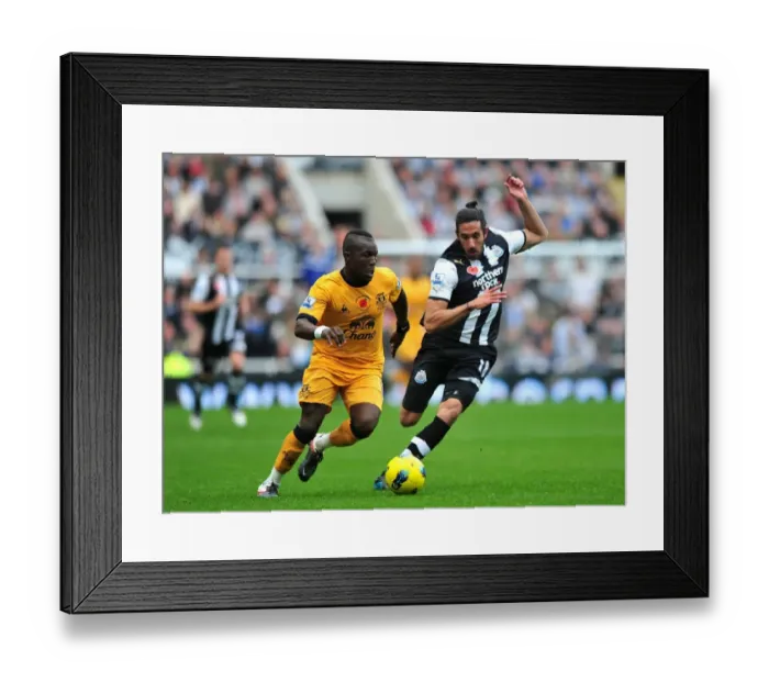 Framed Print : Battle for the Ball: Royston Drenthe vs. Jonas Gutierrez - Premier League Clash (November 2011)