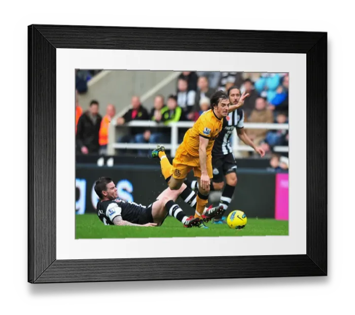 Framed Print : Clash at St. James Park: Danny Guthrie vs. Leighton Baines - Premier League Showdown (Newcastle United vs. Everton, 05 November 2011)