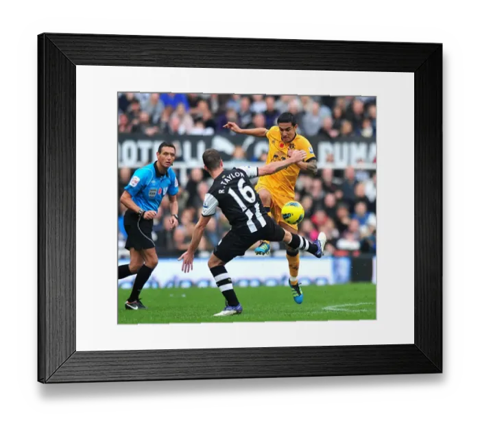 Framed Print : Intense Rivalry: Cahill vs Taylor Battle for Ball in Newcastle vs Everton Premier League Clash (05 November 2011)
