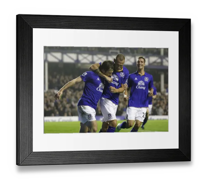 Framed Print : Everton's Baines Scores Penalty, Celebrates with Heitinga and Vellios: A Triumphant Moment at Goodison Park (19 November 2011 vs. Wolverhampton Wanderers) Framed Print : Everton's Baines Scores Penalty, Celebrates with Heitinga and Vellios: A Triumphant Moment at Goodison Park (19 November 2011 vs. Wolverhampton Wanderers)