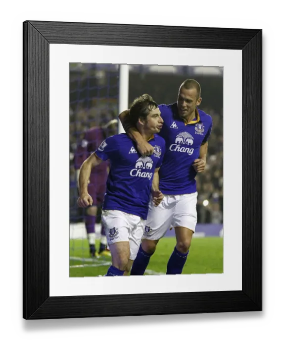 Framed Print : Leighton Baines Scores and Celebrates with Heitinga: Everton's Penalty Goal vs. Wolverhampton Wanderers (Nov 2011) Framed Print : Leighton Baines Scores and Celebrates with Heitinga: Everton's Penalty Goal vs. Wolverhampton Wanderers (Nov 2011)