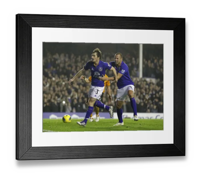 Framed Print : Leighton Baines Penalty Goal and Celebration with Heitinga: Everton's Victory Moment vs. Wolverhampton Wanderers (Nov 2011) Framed Print : Leighton Baines Penalty Goal and Celebration with Heitinga: Everton's Victory Moment vs. Wolverhampton Wanderers (Nov 2011)