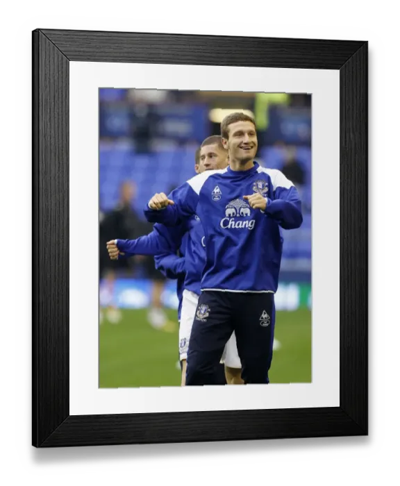 Framed Print : Shkodran Mustafi Leads Everton's Warm-Up Ahead of Premier League Showdown vs. Wolverhampton Wanderers (November 19, 2011, Goodison Park)