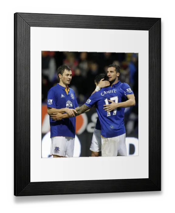 Framed Print : Everton's Victory Moment: Vellios, Bilyaletdinov, and Cahill Celebrate Second Goal Against Bolton Wanderers