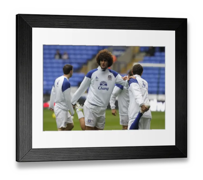 Framed Print : Marouane Fellaini's Focused Warm-Up Ahead of Bolton Wanderers vs Everton (November 26, 2011)