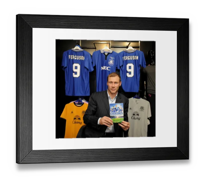 Framed Print : Duncan Ferguson poses with a copy of Evertons Greatest Premier League XI DVD in the Everton Two Store at Liverpool One Framed Print : Duncan Ferguson poses with a copy of Evertons Greatest Premier League XI DVD in the Everton Two Store at Liverpool One