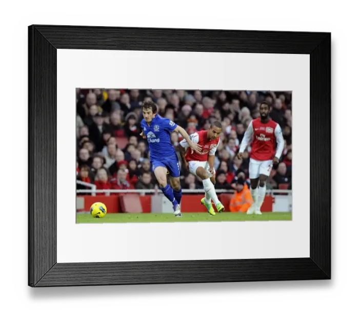Framed Print : Clash at Emirates: Baines vs. Walcott - Intense Rivalry in Arsenal vs. Everton (10 December 2011) Framed Print : Clash at Emirates: Baines vs. Walcott - Intense Rivalry in Arsenal vs. Everton (10 December 2011)