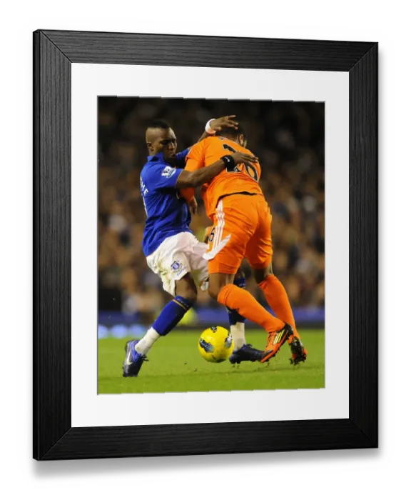 Framed Print : Clash at Goodison Park: Royston Drenthe vs Kemy Agustien - A Battle for Ball Supremacy (Everton vs Swansea City, Barclays Premier League, 21 December 2011) Framed Print : Clash at Goodison Park: Royston Drenthe vs Kemy Agustien - A Battle for Ball Supremacy (Everton vs Swansea City, Barclays Premier League, 21 December 2011)