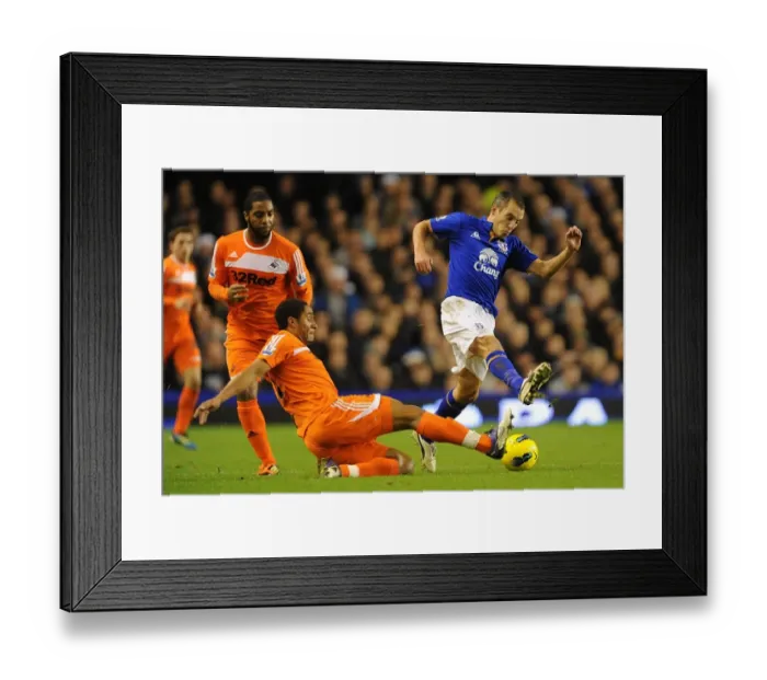 Framed Print : Battle for the Ball: Osman vs. Williams - Everton vs. Swansea City Rivalry in the Premier League (December 2011) Framed Print : Battle for the Ball: Osman vs. Williams - Everton vs. Swansea City Rivalry in the Premier League (December 2011)