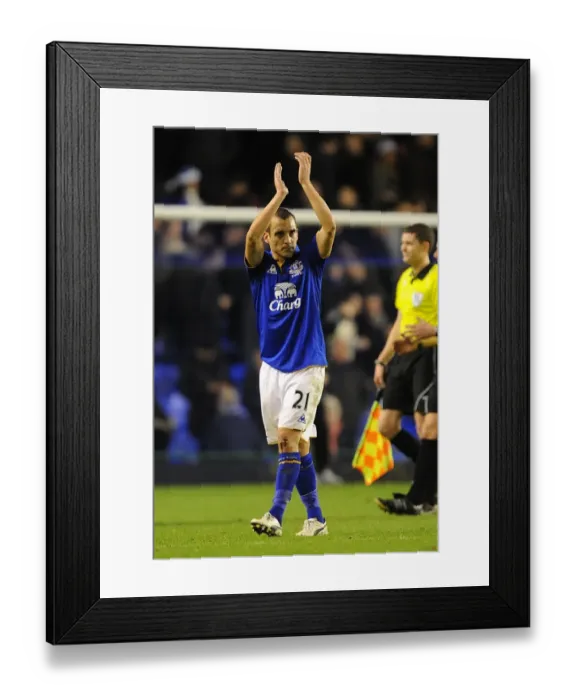 Framed Print : Everton's Leon Osman Salutes Home Fans After Everton FC's Victory Over Swansea City (21 December 2011, Goodison Park) Framed Print : Everton's Leon Osman Salutes Home Fans After Everton FC's Victory Over Swansea City (21 December 2011, Goodison Park)