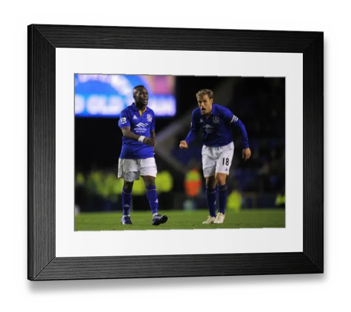 Framed Print : Everton FC: A Premier League Rivalry - Royston Drenthe vs Phil Neville (17 December 2011, Everton vs Norwich City, Goodison Park) Framed Print : Everton FC: A Premier League Rivalry - Royston Drenthe vs Phil Neville (17 December 2011, Everton vs Norwich City, Goodison Park)