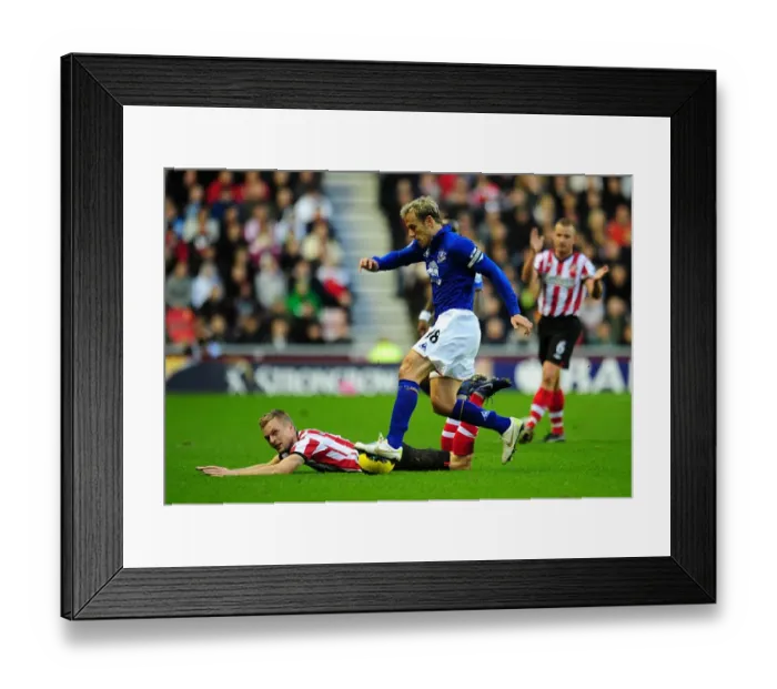 Framed Print : Intense Moment: Phil Neville Stops Sebastian Larsson's Goal Attempt in Sunderland vs. Everton (December 2011) Framed Print : Intense Moment: Phil Neville Stops Sebastian Larsson's Goal Attempt in Sunderland vs. Everton (December 2011)