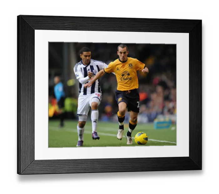 Framed Print : Battle for the Ball: Osman vs. Thomas - Everton vs. West Bromwich Albion in the Premier League (01 January 2012) Framed Print : Battle for the Ball: Osman vs. Thomas - Everton vs. West Bromwich Albion in the Premier League (01 January 2012)