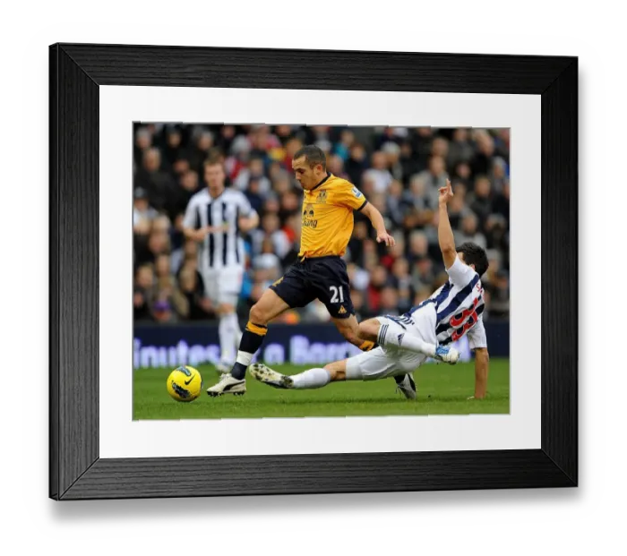 Framed Print : Clash at The Hawthorns: Paul Scharner Tackles Leon Osman (Everton vs. West Bromwich Albion, 01 January 2012) Framed Print : Clash at The Hawthorns: Paul Scharner Tackles Leon Osman (Everton vs. West Bromwich Albion, 01 January 2012)