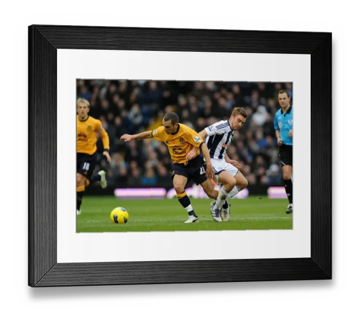 Framed Print : Battle for the Ball: Morrison vs Osman - Premier League Clash between West Bromwich Albion and Everton (01 January 2012) Framed Print : Battle for the Ball: Morrison vs Osman - Premier League Clash between West Bromwich Albion and Everton (01 January 2012)