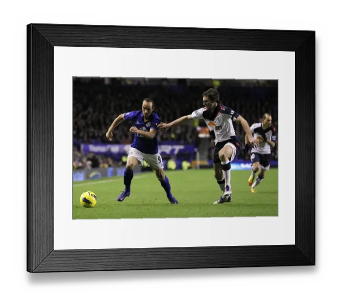 Framed Print : A Battle for the Ball: Donovan vs. Ricketts in the Premier League Clash between Everton and Bolton Wanderers (January 2012) Framed Print : A Battle for the Ball: Donovan vs. Ricketts in the Premier League Clash between Everton and Bolton Wanderers (January 2012)