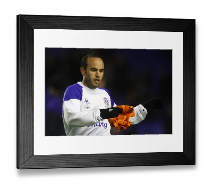 Framed Print : Landon Donovan Stretching During Everton's Premier League Warm-Up vs. Bolton Wanderers (04 January 2012)