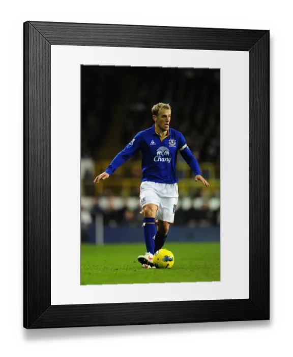 Framed Print : Phil Neville Faces Off Against Tottenhotspur in Intense Barclays Premier League Clash at White Hart Lane (11 January 2012) Framed Print : Phil Neville Faces Off Against Tottenhotspur in Intense Barclays Premier League Clash at White Hart Lane (11 January 2012)