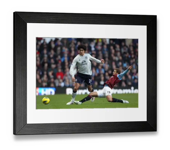 Framed Print : Clash at Villa Park: Petrov vs. Fellaini - A Premier League Battle Framed Print : Clash at Villa Park: Petrov vs. Fellaini - A Premier League Battle