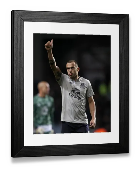 Framed Print : Everton's Johnny Heitinga: Victory Salute to Faithful Fans at Villa Park (14 January 2012) Framed Print : Everton's Johnny Heitinga: Victory Salute to Faithful Fans at Villa Park (14 January 2012)