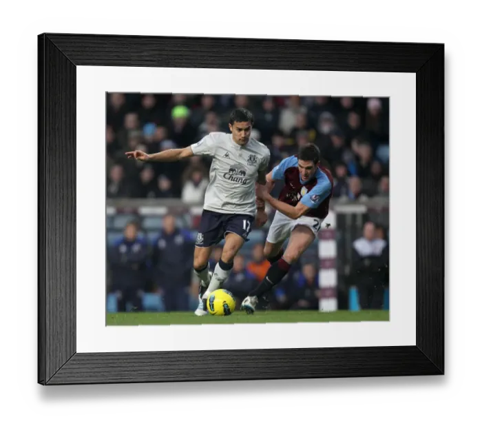 Framed Print : Intense Premier League Showdown: Tim Cahill vs. Ciaran Clark - Battle for Ball Possession (2012, Aston Villa vs. Everton)