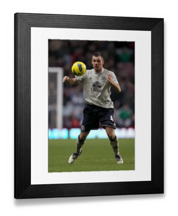 Framed Print : Everton's Darron Gibson in Action: Premier League Showdown vs. Aston Villa (January 2012)