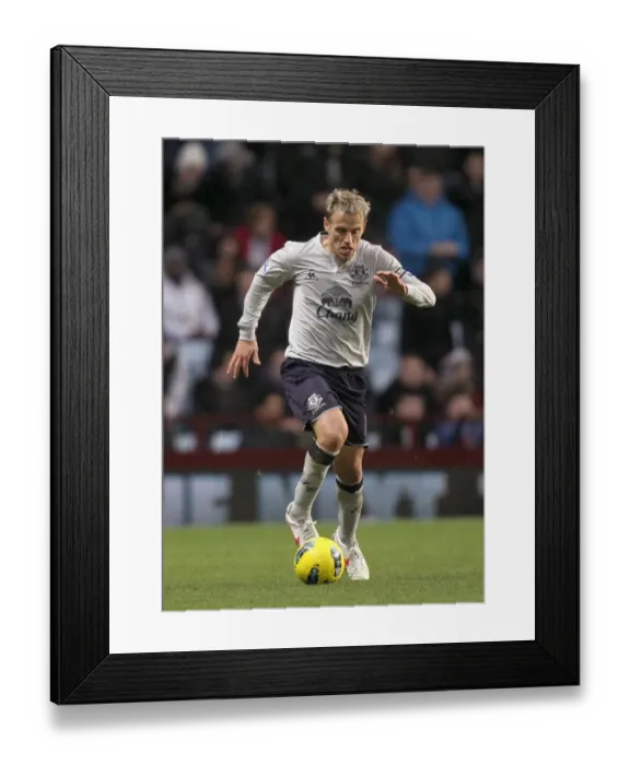 Framed Print : Phil Neville vs. Aston Villa: Everton's Battle in the Barclays Premier League (14 January 2012) Framed Print : Phil Neville vs. Aston Villa: Everton's Battle in the Barclays Premier League (14 January 2012)