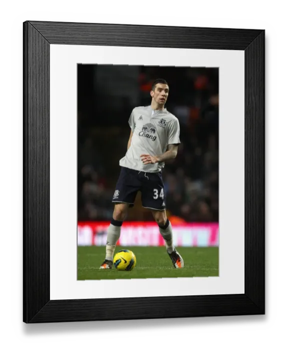 Framed Print : Everton's Shane Duffy in Action: The Intense Rivalry - Everton vs. Aston Villa, Premier League (14 January 2012)