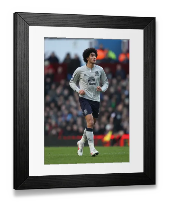 Framed Print : Marouane Fellaini: Everton's Midfield Maestro in the Thrilling Rivalry against Aston Villa (14 January 2012) Framed Print : Marouane Fellaini: Everton's Midfield Maestro in the Thrilling Rivalry against Aston Villa (14 January 2012)