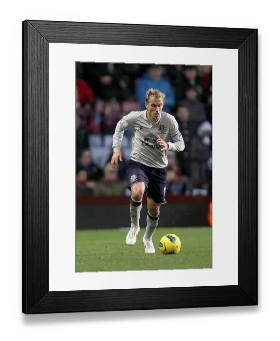 Framed Print : Phil Neville's Intense Battle: Everton vs. Aston Villa (Premier League, 14 January 2012) Framed Print : Phil Neville's Intense Battle: Everton vs. Aston Villa (Premier League, 14 January 2012)
