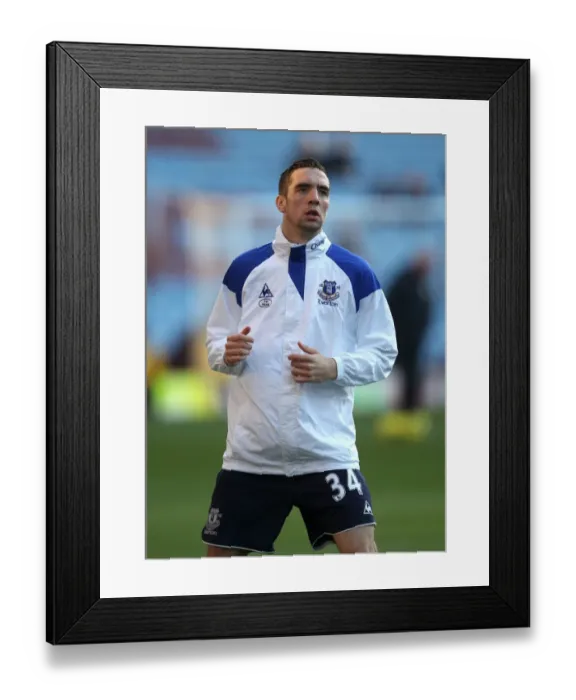 Framed Print : Everton's Shane Duffy in the Heat of the Rivalry: Aston Villa vs. Everton in the Premier League (14 January 2012)