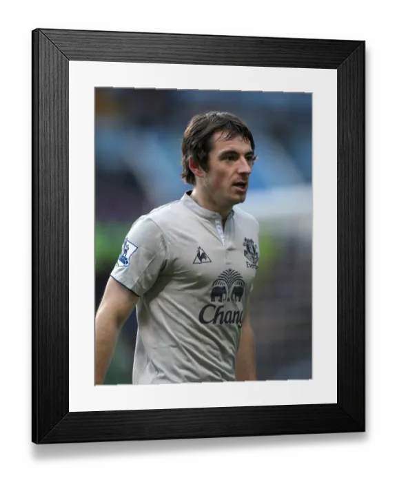 Framed Print : The Intense Rivalry: Everton's Leighton Baines in Action vs. Aston Villa, Premier League (14 January 2012)
