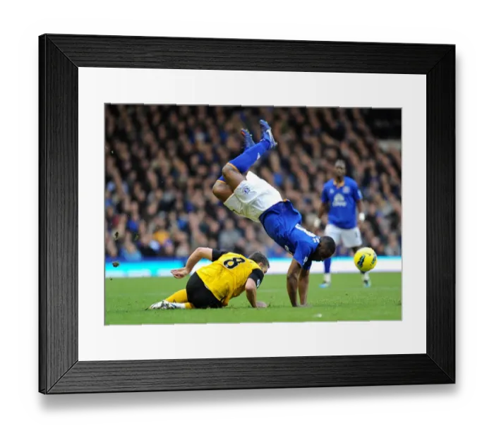 Framed Print : David Dunn's Slide Tackle on Victor Anichebe: A Premier League Rivalry at Goodison Park (21 January 2012) Framed Print : David Dunn's Slide Tackle on Victor Anichebe: A Premier League Rivalry at Goodison Park (21 January 2012)