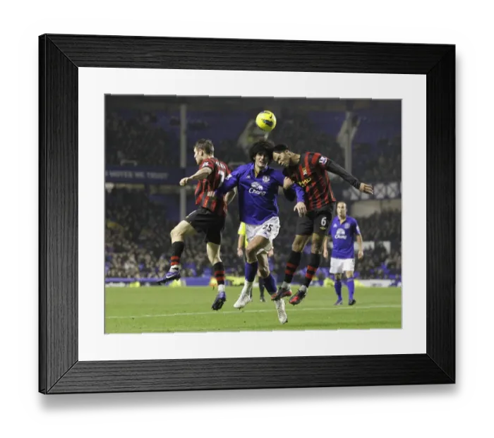 Framed Print : Marouane Fellaini vs Milner & Lescott: Everton's Midfield Battle against Manchester City (31 January 2012) Framed Print : Marouane Fellaini vs Milner & Lescott: Everton's Midfield Battle against Manchester City (31 January 2012)
