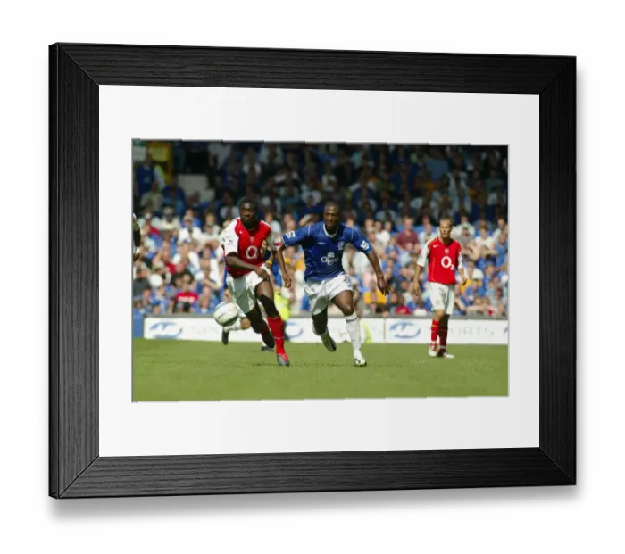 Framed Print : Everton vs Arsenal, August 15, 2004, Barclays Premiership, Goodison Park - Intense Moment between Kevin Campbell and Unnamed Arsenal Player Framed Print : Everton vs Arsenal, August 15, 2004, Barclays Premiership, Goodison Park - Intense Moment between Kevin Campbell and Unnamed Arsenal Player