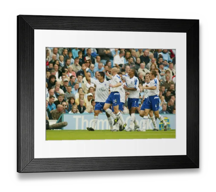 Framed Print : Tim Cahill's Euphoric Celebration: Manchester Derby Goal at City of Manchester Stadium (Manchester City vs Everton, September 11, 2004) Framed Print : Tim Cahill's Euphoric Celebration: Manchester Derby Goal at City of Manchester Stadium (Manchester City vs Everton, September 11, 2004)