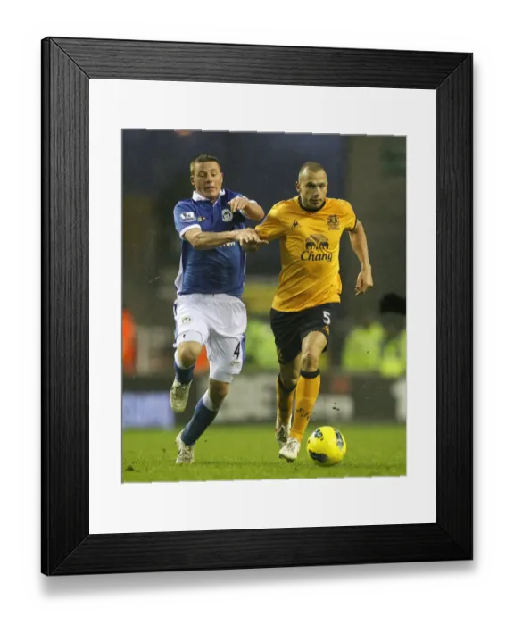 Framed Print : Intense Rivalry: Heitinga vs McCarthy's Battle for Ball Possession - Wigan Athletic vs Everton, Barclays Premier League (04 February 2012) Framed Print : Intense Rivalry: Heitinga vs McCarthy's Battle for Ball Possession - Wigan Athletic vs Everton, Barclays Premier League (04 February 2012)