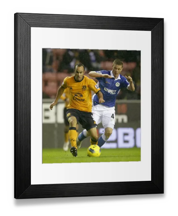 Framed Print : Battle for the Ball: Donovan vs. McCarthy - Everton vs. Wigan Athletic (February 2012)