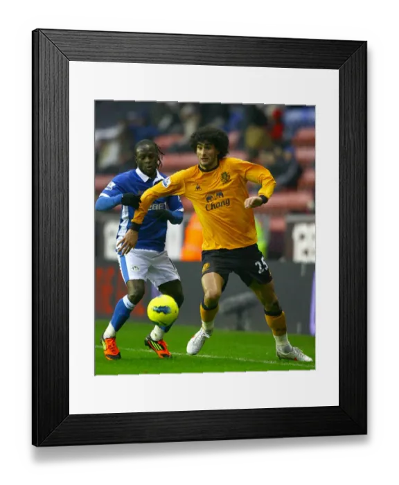 Framed Print : Fellaini vs. Moses: An Intense Barclays Premier League Battle at DW Stadium (04 February 2012) Framed Print : Fellaini vs. Moses: An Intense Barclays Premier League Battle at DW Stadium (04 February 2012)