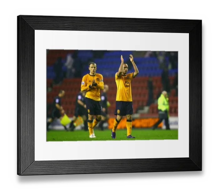 Framed Print : Everton's Neville and Donovan Celebrate with Fans After Wigan Victory (04 February 2012) Framed Print : Everton's Neville and Donovan Celebrate with Fans After Wigan Victory (04 February 2012)