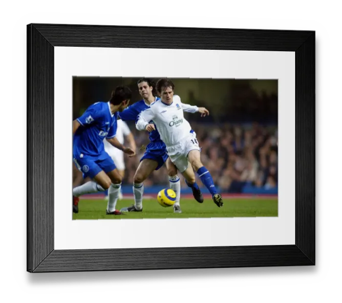 Framed Print : Kevin Kilbane beats Tiago