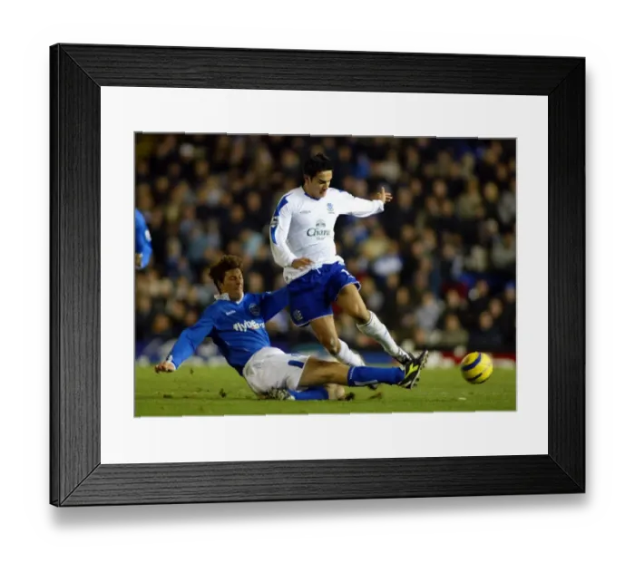 Framed Print : Tim Cahill is tackled Framed Print : Tim Cahill is tackled