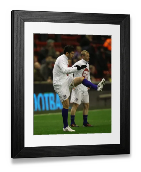Framed Print : Denis Stracqualursi of Everton Stretching During Warm-Up Ahead of Liverpool Clash (13 March 2012, Anfield)