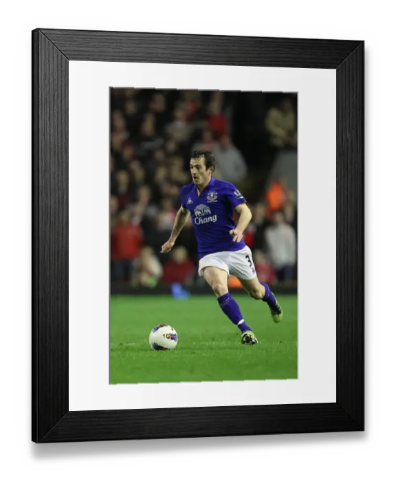 Framed Print : Everton vs. Liverpool Rivalry: Leighton Baines Intense Battle at Anfield (13 March 2012)