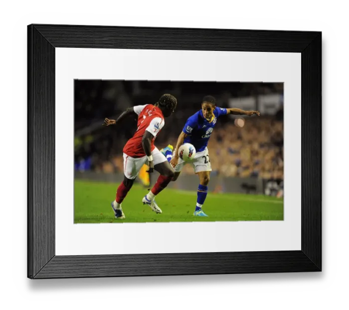 Framed Print : Battle for the Ball: Pienaar vs. Sagna - Everton vs. Arsenal Rivalry in the Premier League (21 March 2012)