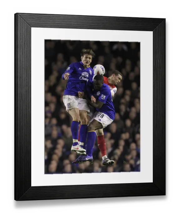 Framed Print : Battle at Goodison Park: Vermaelen vs. Anichebe and Jelavic - Everton vs. Arsenal, Premier League 2012 Framed Print : Battle at Goodison Park: Vermaelen vs. Anichebe and Jelavic - Everton vs. Arsenal, Premier League 2012