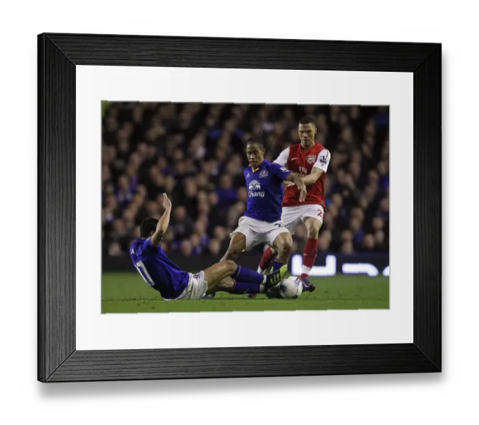 Framed Print : Everton's Powerhouse Duo: Tim Cahill and Steven Pienaar Outmuscle Arsenal's Kieran Gibbs at Goodison Park (21 March 2012) Framed Print : Everton's Powerhouse Duo: Tim Cahill and Steven Pienaar Outmuscle Arsenal's Kieran Gibbs at Goodison Park (21 March 2012)