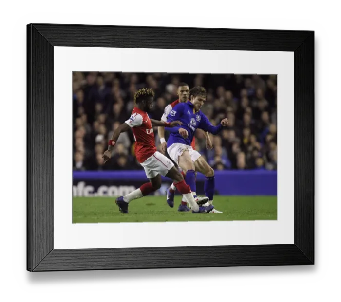 Framed Print : Battle for the Ball: Song vs. Jelavic at Goodison Park - Everton vs. Arsenal, Premier League (21 March 2012) Framed Print : Battle for the Ball: Song vs. Jelavic at Goodison Park - Everton vs. Arsenal, Premier League (21 March 2012)